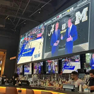 a bar with a large screen