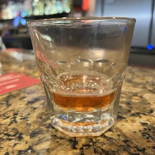 a shot of whiskey in a glass