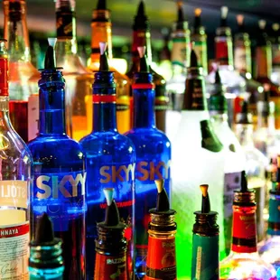 a variety of bottles on a bar