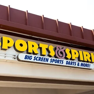 the front of a sports and spirits store