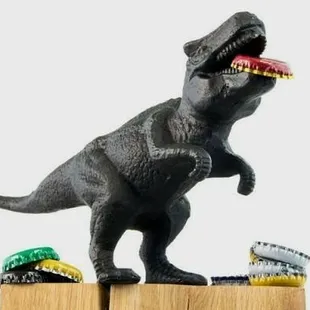 a t - rex on a wooden block