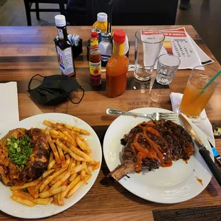 Bone in steak with fries, potato, and sweet tea/ lemonade.