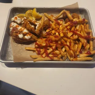 Fish with French fries and a glass of wine