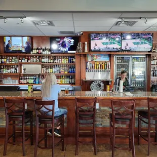 a woman sitting at the bar