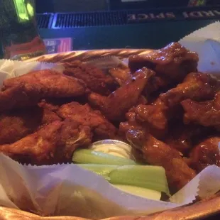 24 wings. Half mango habanero half x-tra hot; bleu cheese and celery. Ask Suzi and Bobbi for the tall beers.