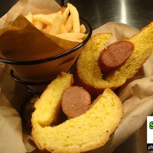 a basket of hot dogs and french fries