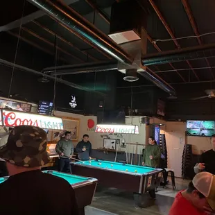 Two pool tables and and shuffle board.