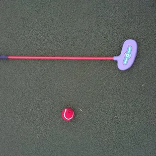 use a tennis ball and a large headed putter to play