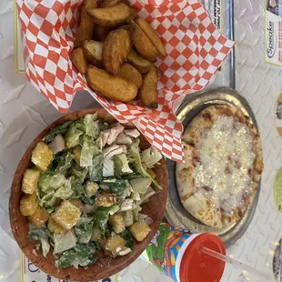 Caesar salad, potato wedges and mini pizza kids meal