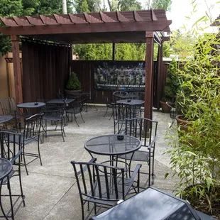 a patio with tables and chairs