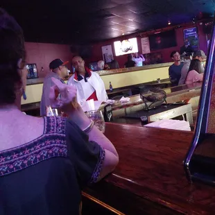 a man and woman at a bar