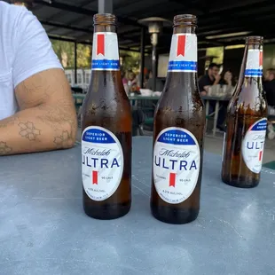 three bottles of beer on a table