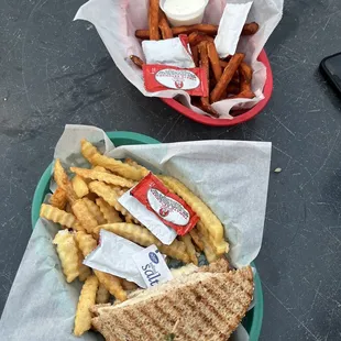 Tuna melt and sweet potato fries with potato fries