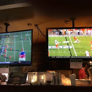 Lots of TVs with sports action