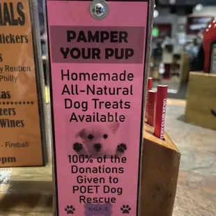 a pink sign for a dog rescue