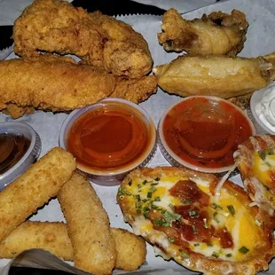 Lagniappe platter (chicken tenders, mozzarella sticks, wings, and potato skins)