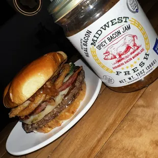 a hamburger and a jar of jam