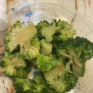 Steamed broccoli that is on the verge of spoiling.