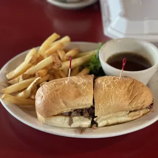 French dip sandwich and fries. You can substitute fries with potato salad or coleslaw.