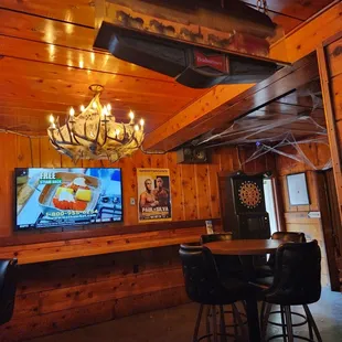 a bar with a spider web hanging from the ceiling