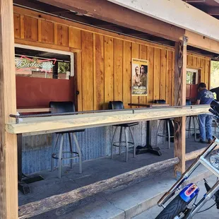 a motorcycle parked in front of a bar