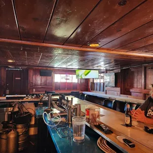 a man and a woman sitting at a bar