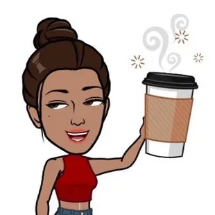 a woman holding a cup of coffee