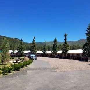 Front side of Sportsman Lodge beautiful pine trees