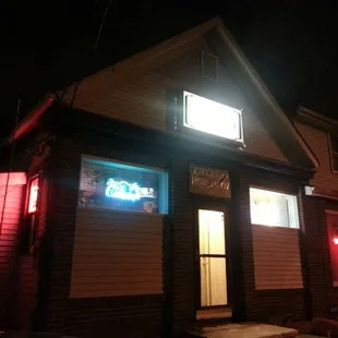 a neon sign in the window