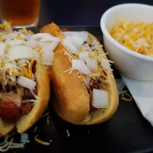 Hotdog platter with mac &amp; cheese instead of fries.