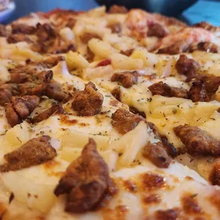 Sweet sausage pizza with Italian sausage five cheeses and pineapple