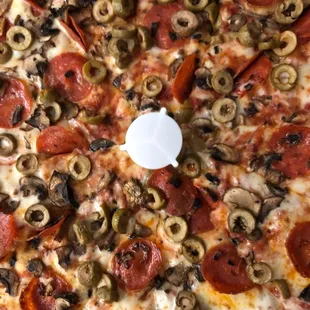 a pepperoni and olive pizza