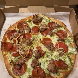 Build your own small Pepperoni with sausage onions and pesto sauce