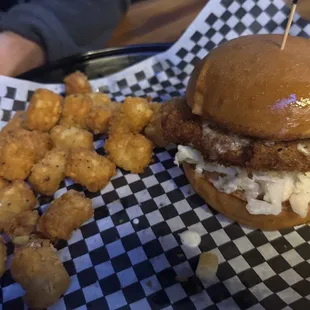 Spicy fried chicken sandwich with tater tots