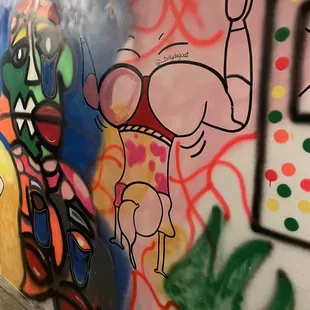 a mural of a man doing a handstand
