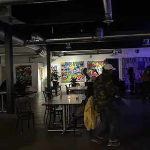 a group of people standing in a room