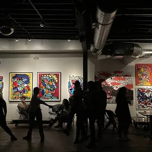 a group of people in a gallery
