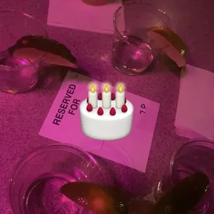 a birthday cake with lit candles