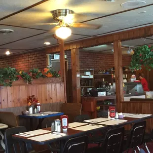 a dining area with tables and chairs