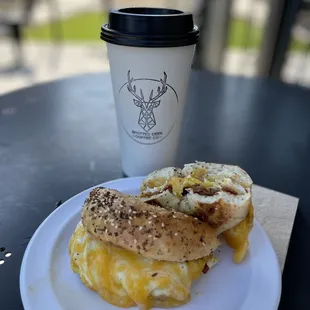 a breakfast sandwich and a cup of coffee