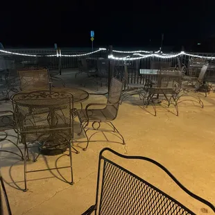 tables and chairs outside at night