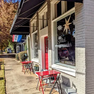 red tables and chairs outside a restaurant