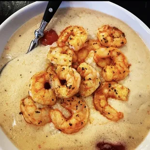 a bowl of shrimp and grits