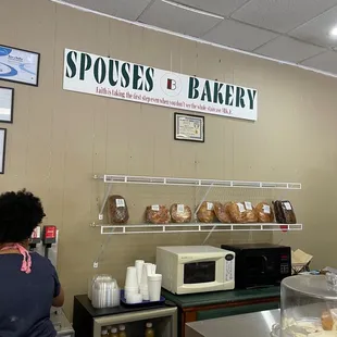 a woman standing in front of the counter