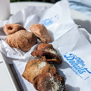 a tray of pastries and a cup of coffee