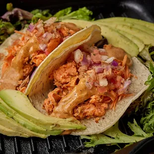 Grill Salmon Chilly lime sauce cabbage-carrot slaw Onion in flour tortillas.