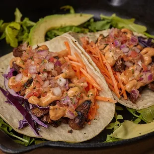 taco, Carrots, onion, red pepper green pepper  wheat gluten, and faba bean Chilly lime sauce