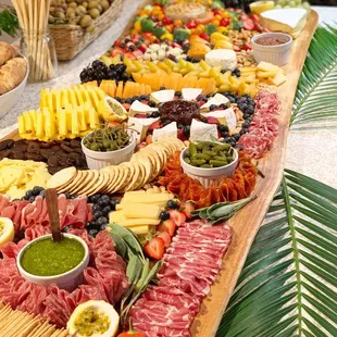 Graze tables for your wedding or event on Oahu, Hawaii. Cheese, charcuterie and more on a large board.