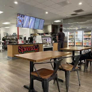 a restaurant with tables and chairs