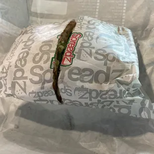 Opened first layer of wrapping- cut in half is great!